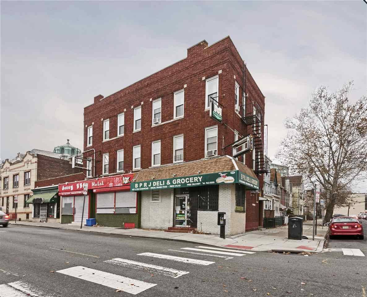 This five unit mixed-use building is comprised of 3 street level retail units and 2 three bedroom residential units