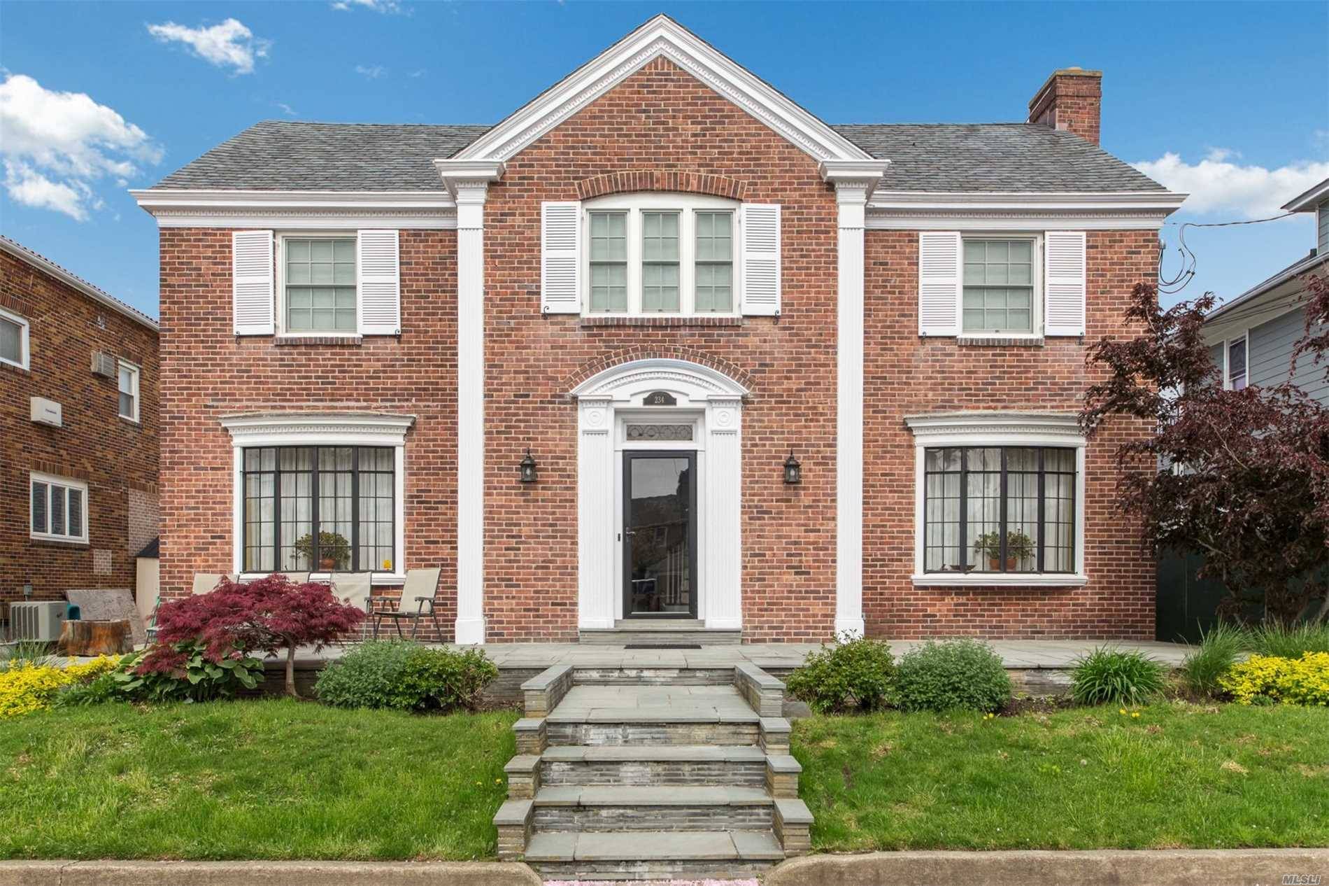 Stately All Brick Center Hall Colonial Home Is Favored By Glorious Sunlight And Positioned On An Expansive 6,000 Sq.