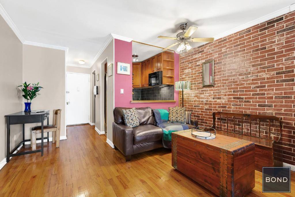This fully renovated corner studio with outdoor space is the largest line in the building.