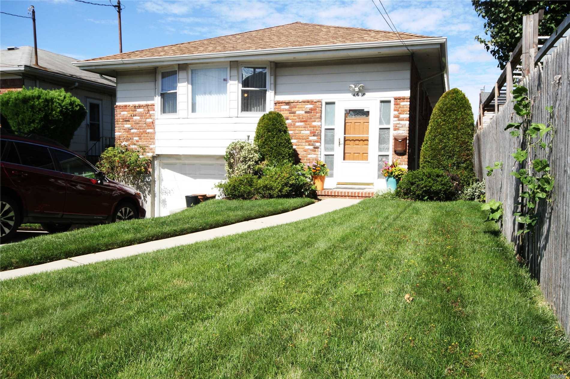 Solid Brick, Detached, Hi Ranch On An Extra Long 37' By 125' Property Located In The Kissena Park Section Of Flushing.