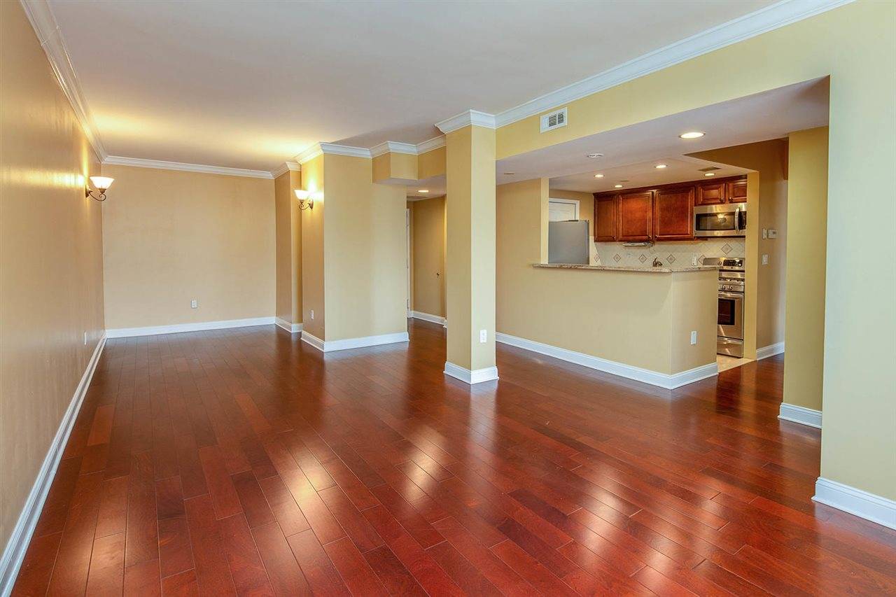 This spacious and bright 3 bedroom/ 2 bath condo features an updated kitchen with stainless appliances