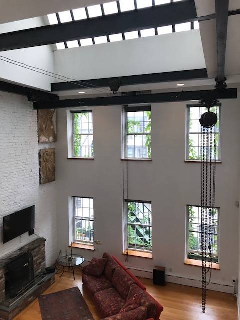 Breathtaking furnished loft with 20' high ceilings and a private terrace in Murray Hill