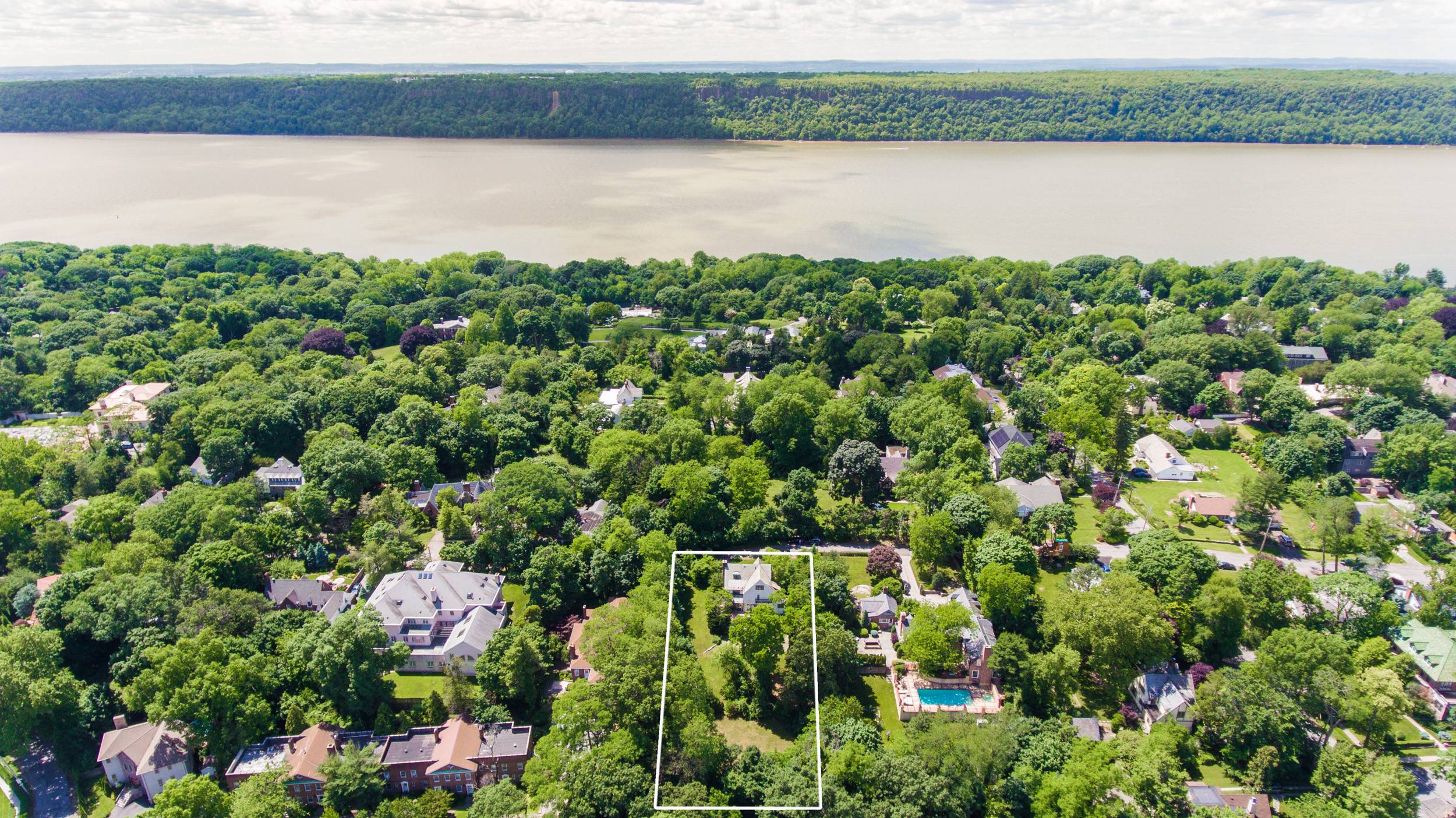 6 Bedroom 5.5 Bathroom Renovated Tudor Mansion in Riverdale Estates!