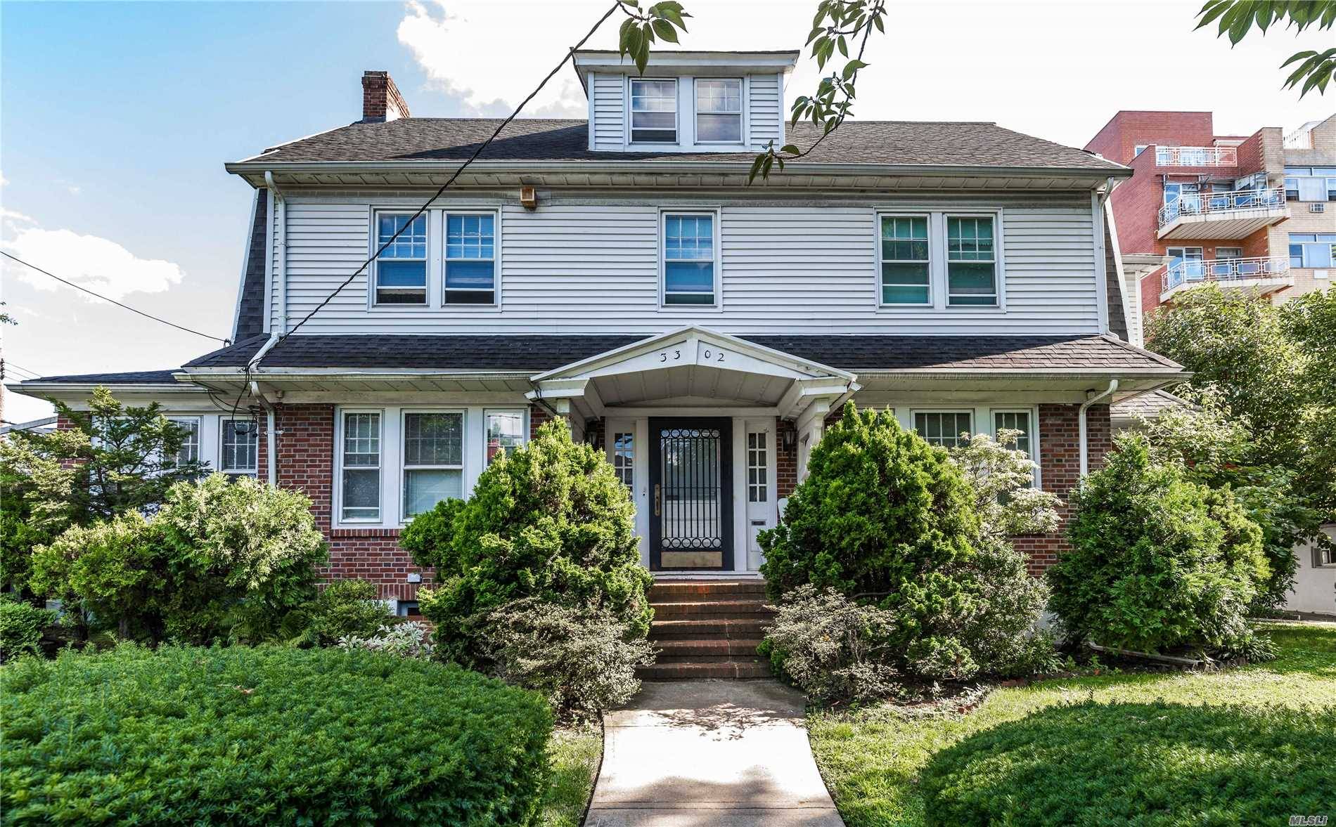 Large Center Hall Colonial Sitting On A Fenced Corner 64X150 Lot In The Heart Of North Flushing.