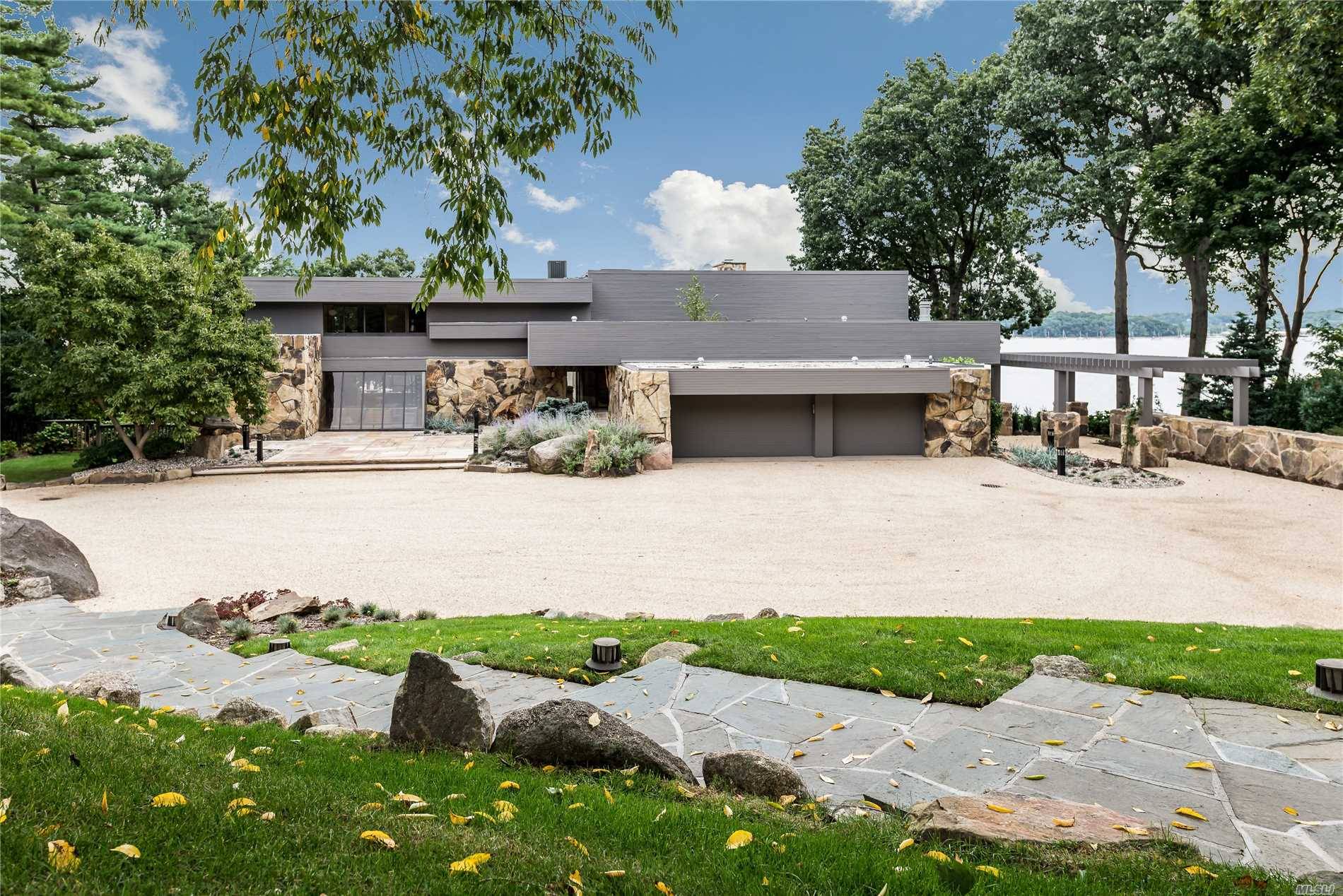 Exceptional Waterfront Contemporary Designed By The Renowned And Highly Acclaimed Architect Norman Jaffe.