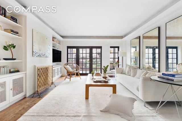 Welcome home to this serene residence on the most beautiful block in Chelsea.