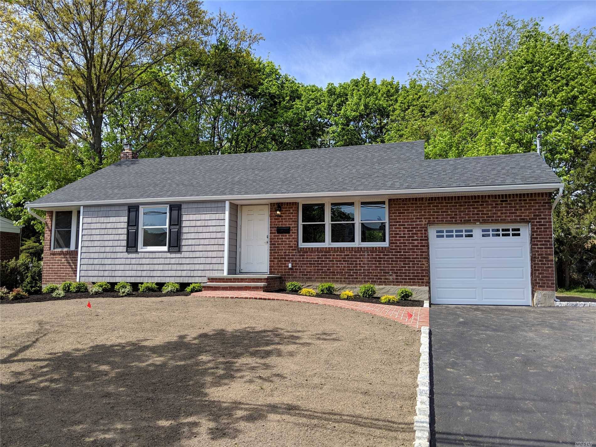 Don't Miss This Completely Renovated 3 Bedroom, 3 Bath Ranch On Wonderful Flat Property.