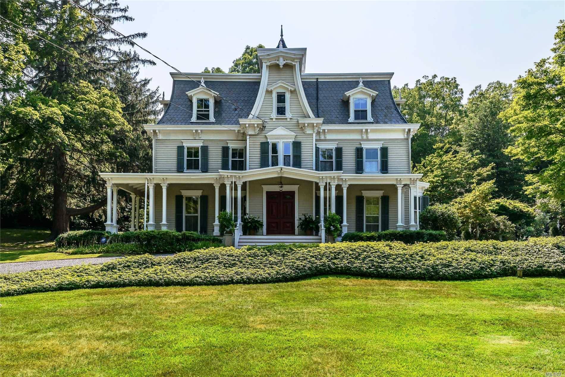 Gracious Victorian residence dressed with exquisite details, prominently set on 2.