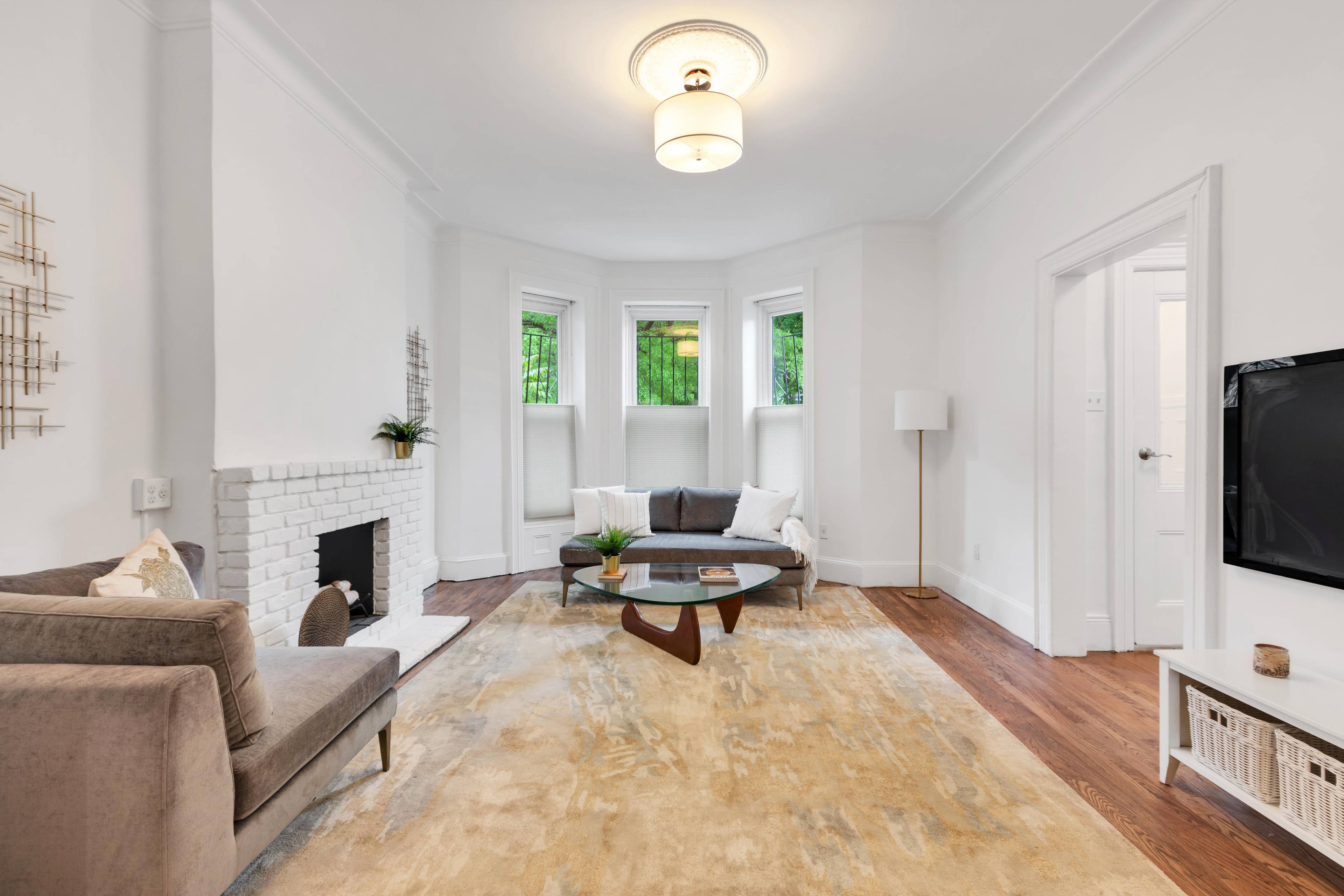 Brick PLG Beauty! A Contemporary Two-Family Home with Gated Parking!