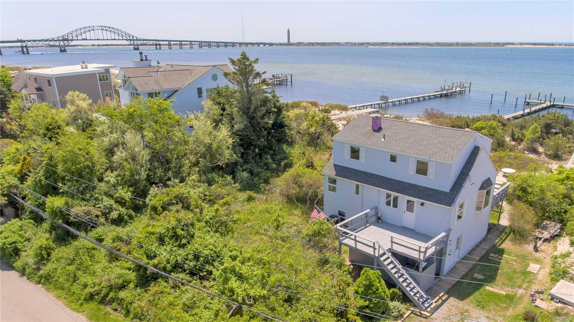 Welcome to the Beach ! Prime Location on Fire Island Inlet secluded behind the gates of Oak Beach Association.
