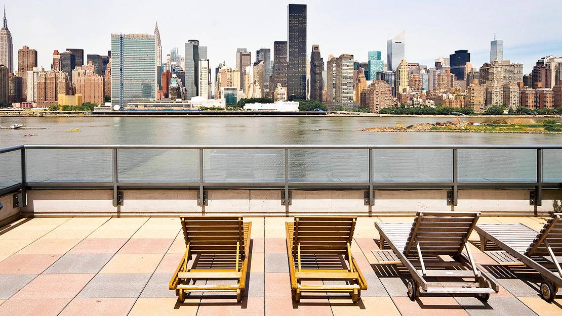 Newly Renovated, Corner 1 Bed with a Pass-Thru Kitchen, a Large Living/Dining Area, and Views of Gantry Park, the East River, and the Manhattan Skyline in LIC