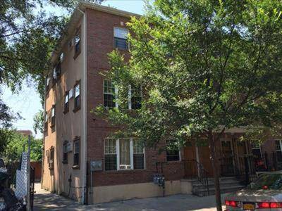 Brick Semi Detached Two Family, Fist unit is a duplex 4 bedroom apt with living room, a dining area, kitchen and two full bath.