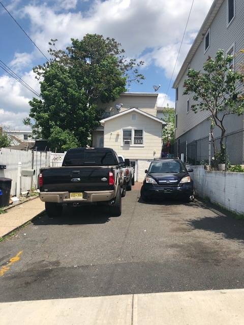 Two Family home with parking and easy commute to NYC.