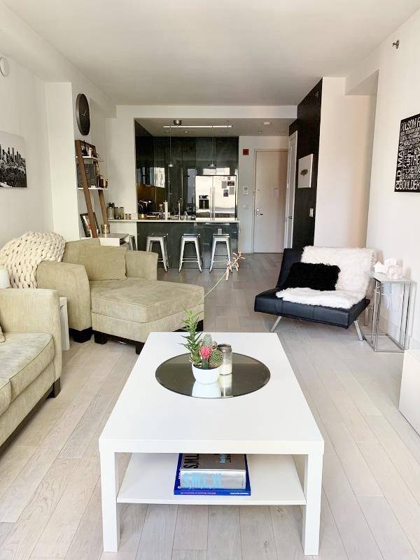 Spacious large 2 bedroom 2 bath with large living and open kitchen, high end kitchen appliances, both bedroom has a separate balcony overlooking Purves street, heated floors thought out the ...