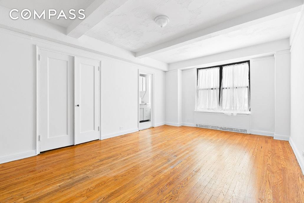 GRACIOUS AND CLASSIC prewar studio in estate condition awaiting your vision.