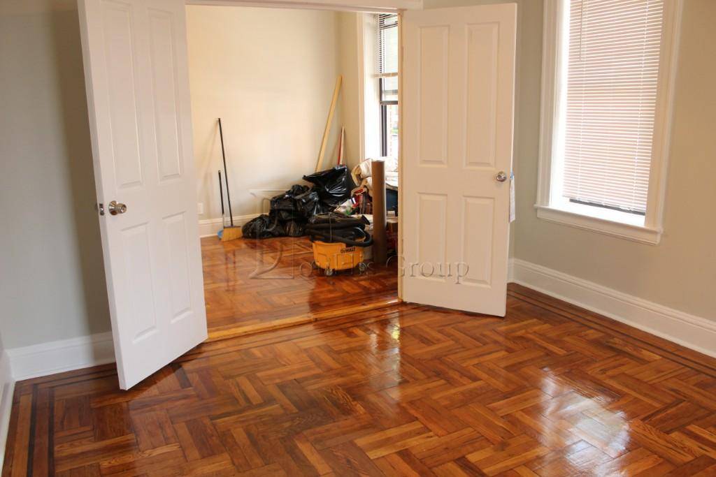 RENOVATED Beautiful 2 bedroom apartment featuring hardwood flooring, and high ceilings with fans in each bedroom.
