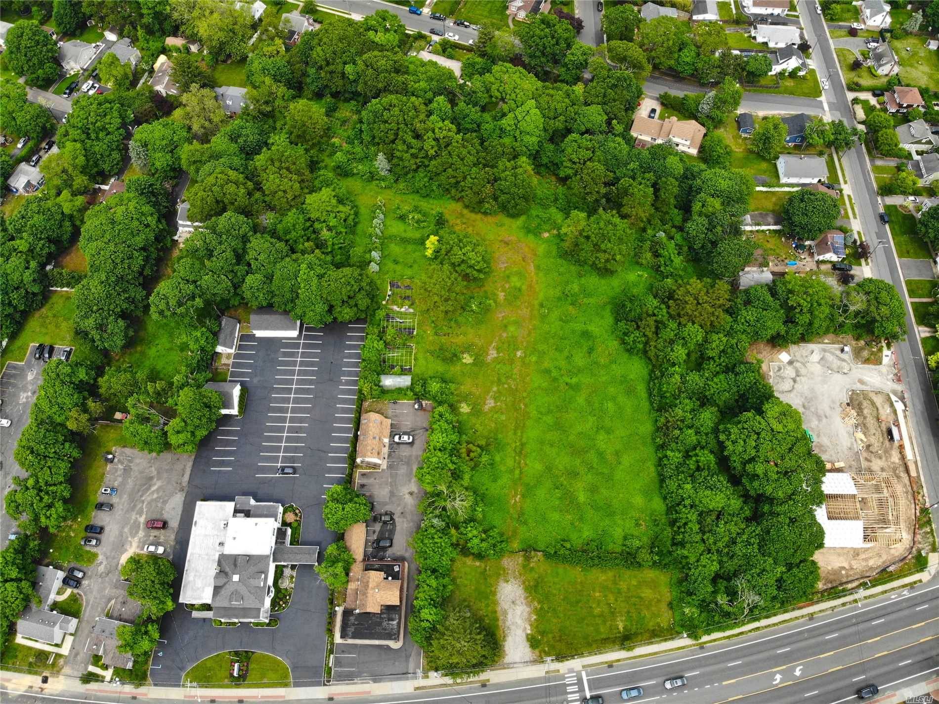 Prime location and opportunity with double curb cut and designated traffic light and arrow.
