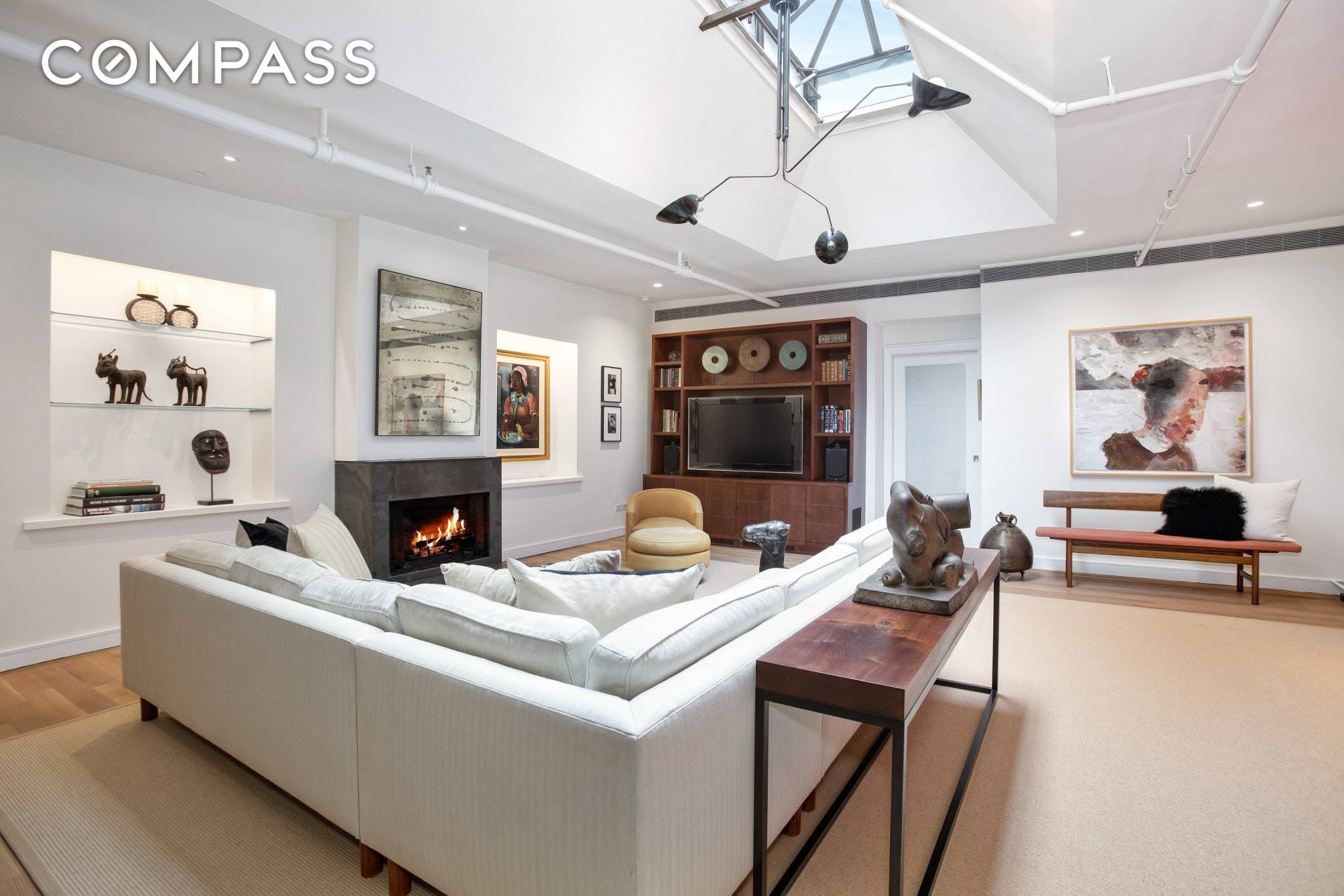 LIGHT AND VIEWS ABOUND IN THIS DRAMATIC FULL FLOOR PENTHOUSE LOCATED ON SOHO'S MOST COVETED STREET !