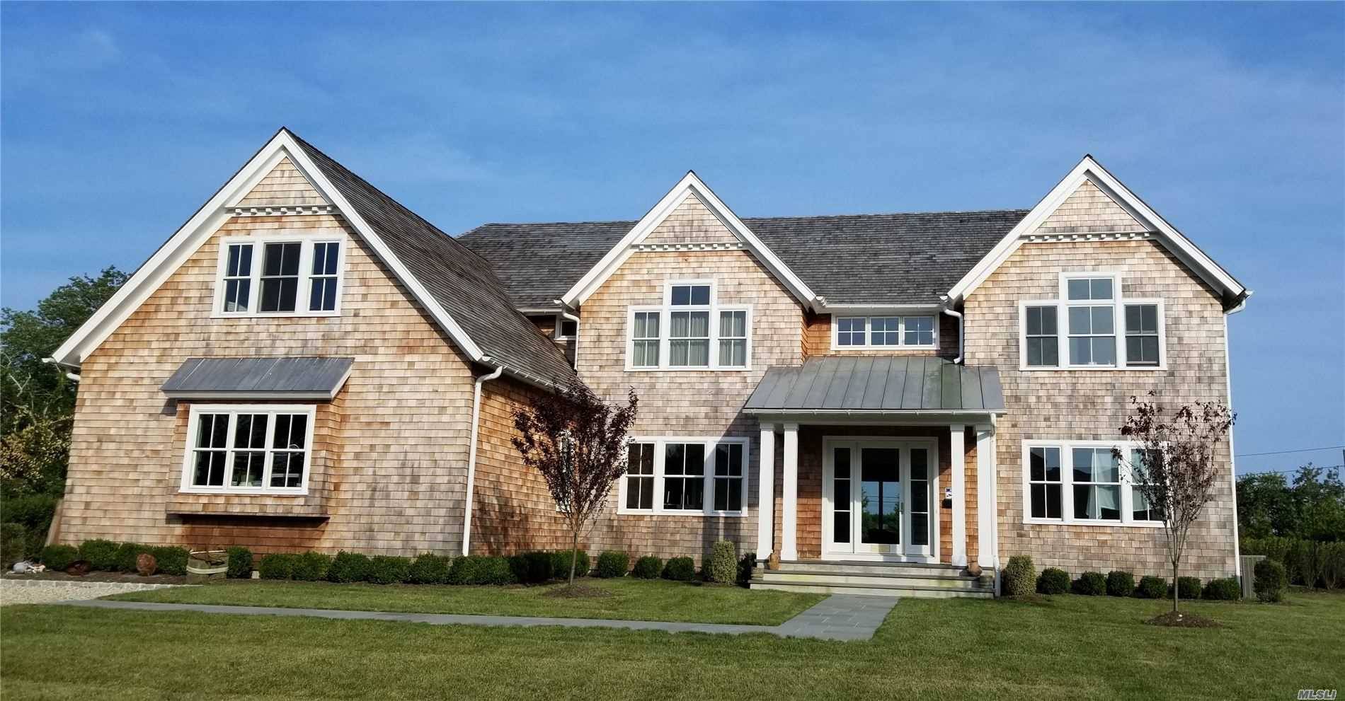 Very rare opportunity to own a custom home and guest cottage south of the highway in the Village of Quogue.