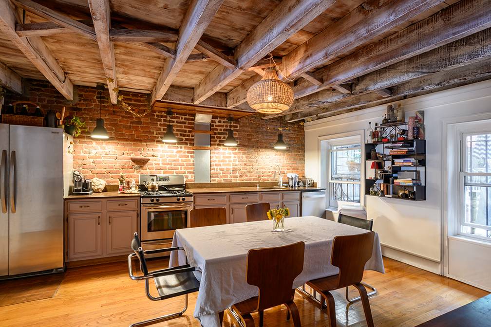 Chic Clinton Hill townhouse boasting a lush backyard and an income-producing rental unit