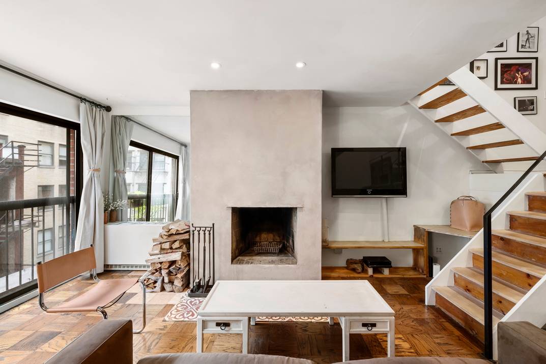 One-of-a Kind Midtown East 1 Bed 1.5 Bath Duplex w. Wood Burning Fire Place