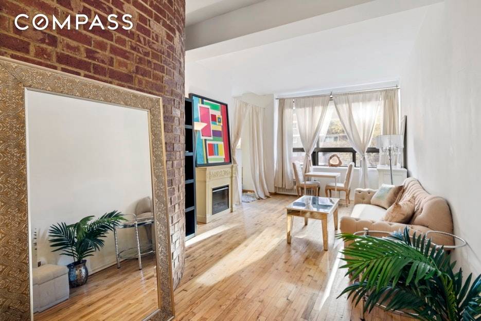Bright Lofty Alcove Studio Unique and spacious, this loft like junior one bedroom features an open floor plan, soaring 11 foot ceilings and a curved brick wall.