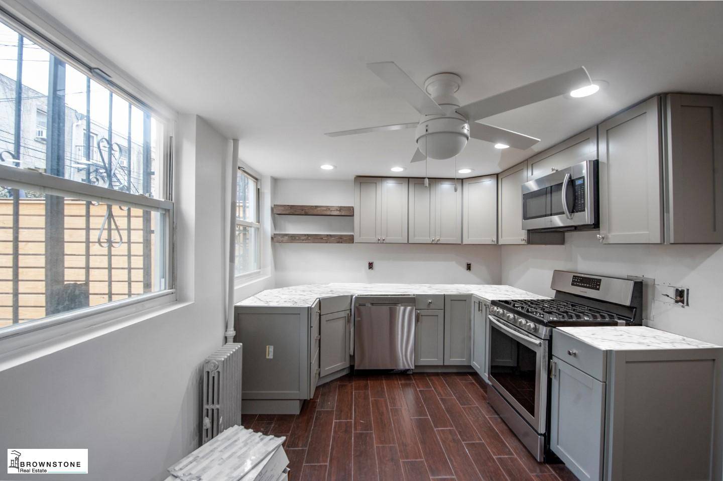 Renovated spacious one bedroom floor through with eat in kitchen with stainless steel appliances, dishwasher included, large living room, hardwood floors, and huge private backyard.