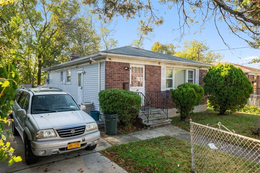 Fully Detached Single Brick Home sits on 50x100 Lot with Full Finished Basement.