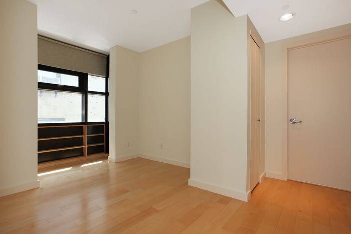 Luxurious light filled 3 bed 2 bath condominium unit in a modern elevator building on a quiet cobblestone street.