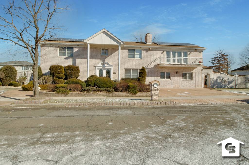 Beautiful all brick colonial two family home situated on a tremendous double lot 140 x 110.