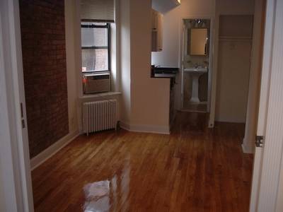 Renovated one bedroom with dishwasher, exposed brick, and marble bath in West Village