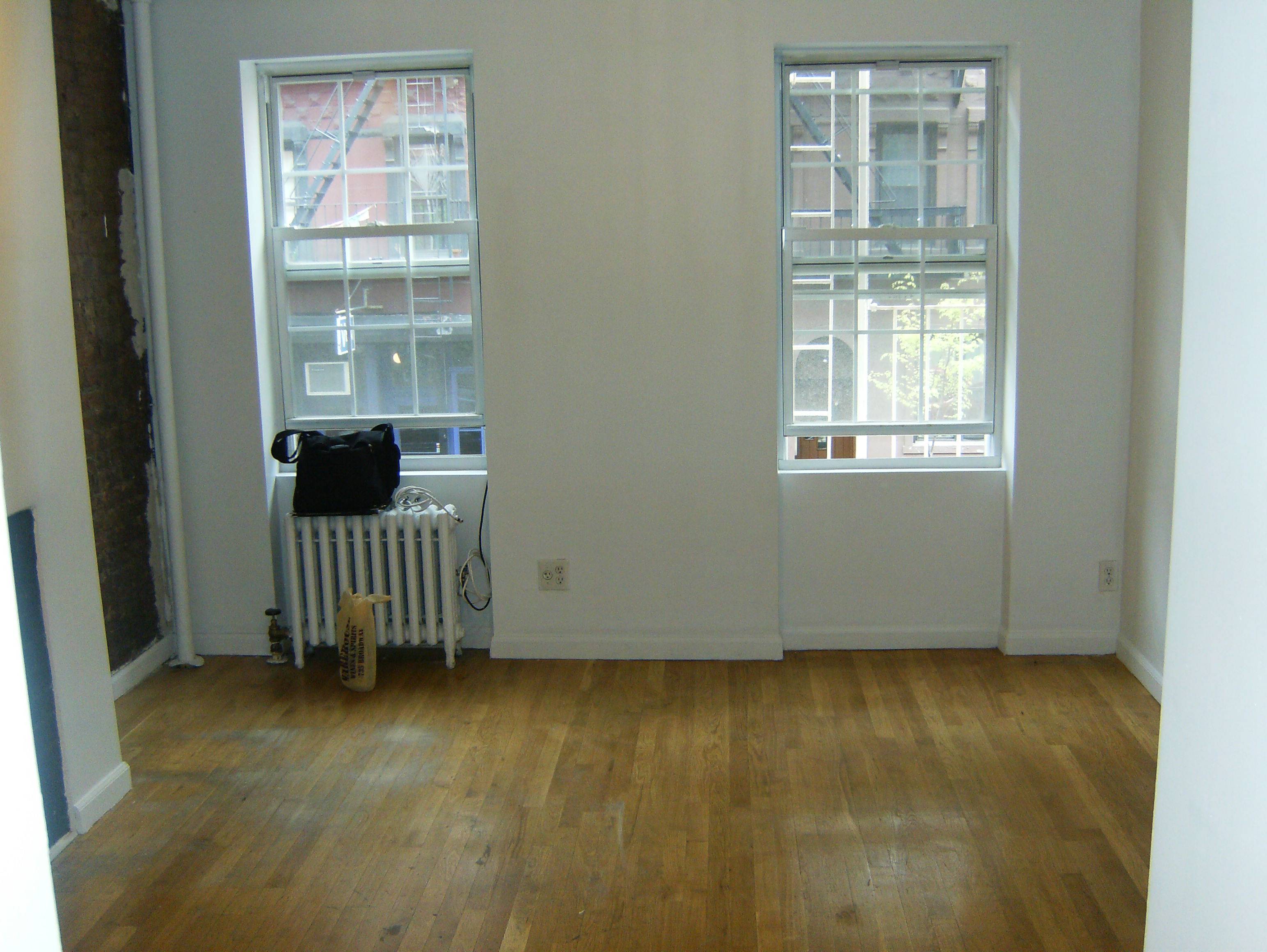 Renovated studio with exposed brick and marble bath in ideal Greenwich Village 