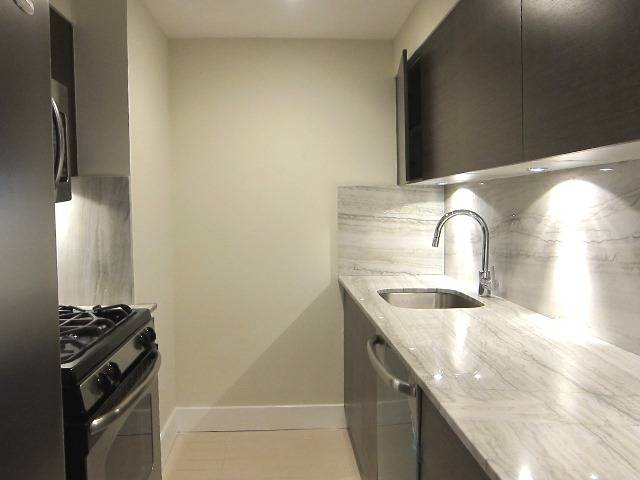 NORTH EAST CORNER THREE BED, TWO BATH! HOT EAST 60'S FIND WITH CONDO FINISHES, W/D AND TERRACE!!