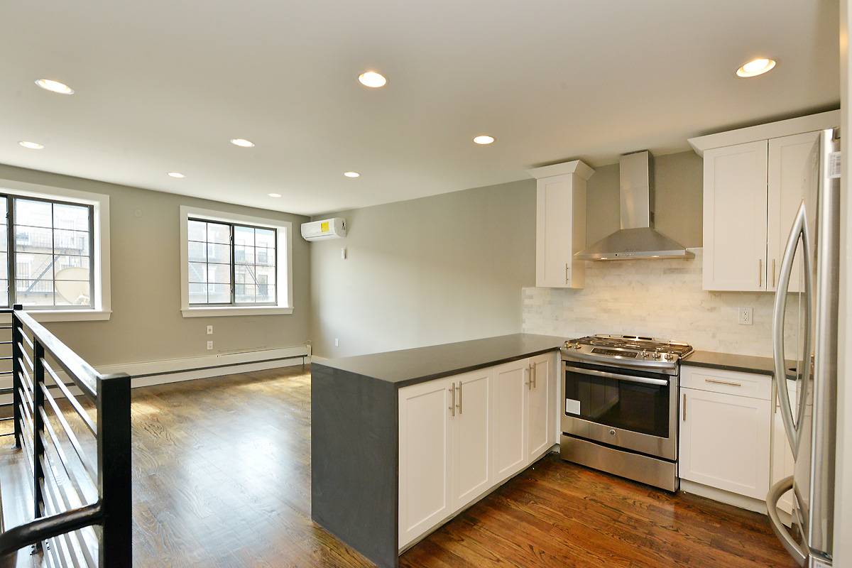 **Gut Renovated Two-Family Double Duplex with Parking Close to Transit**