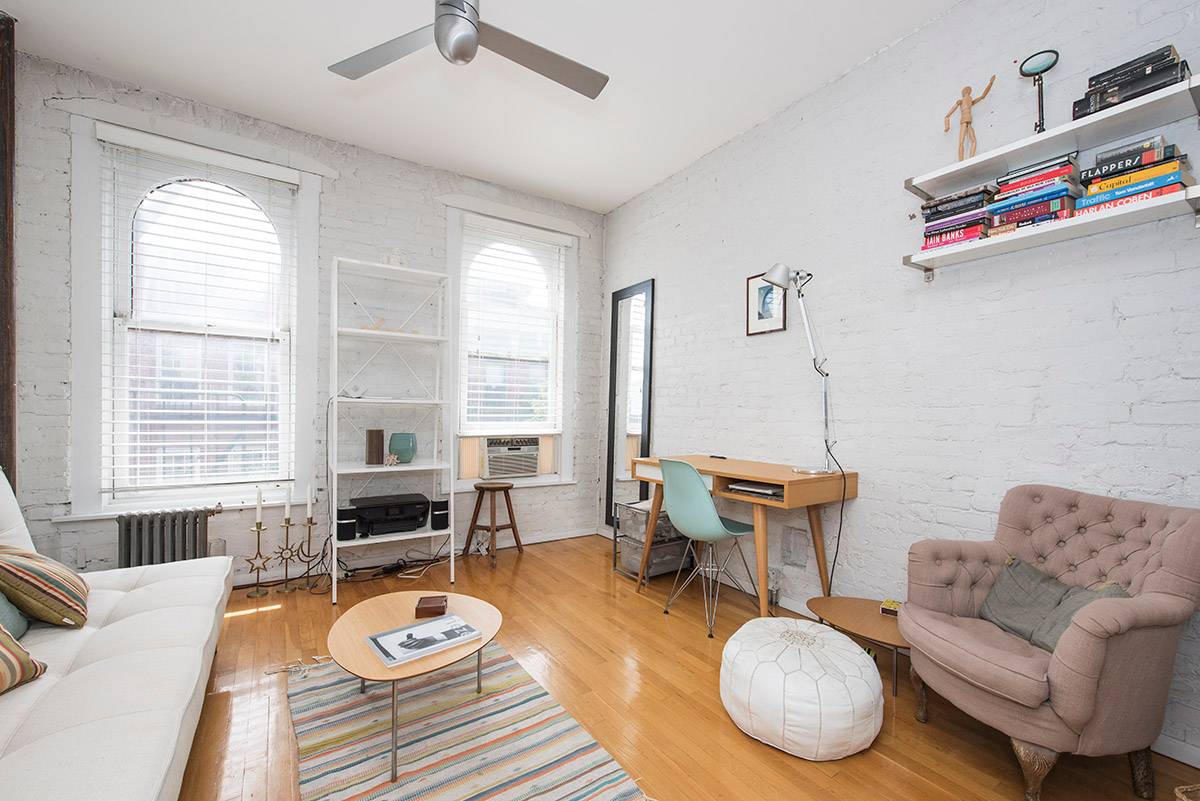 Sun filled unit on Beautiful Perry Street in the West Village. Living room views of World Trade Center.