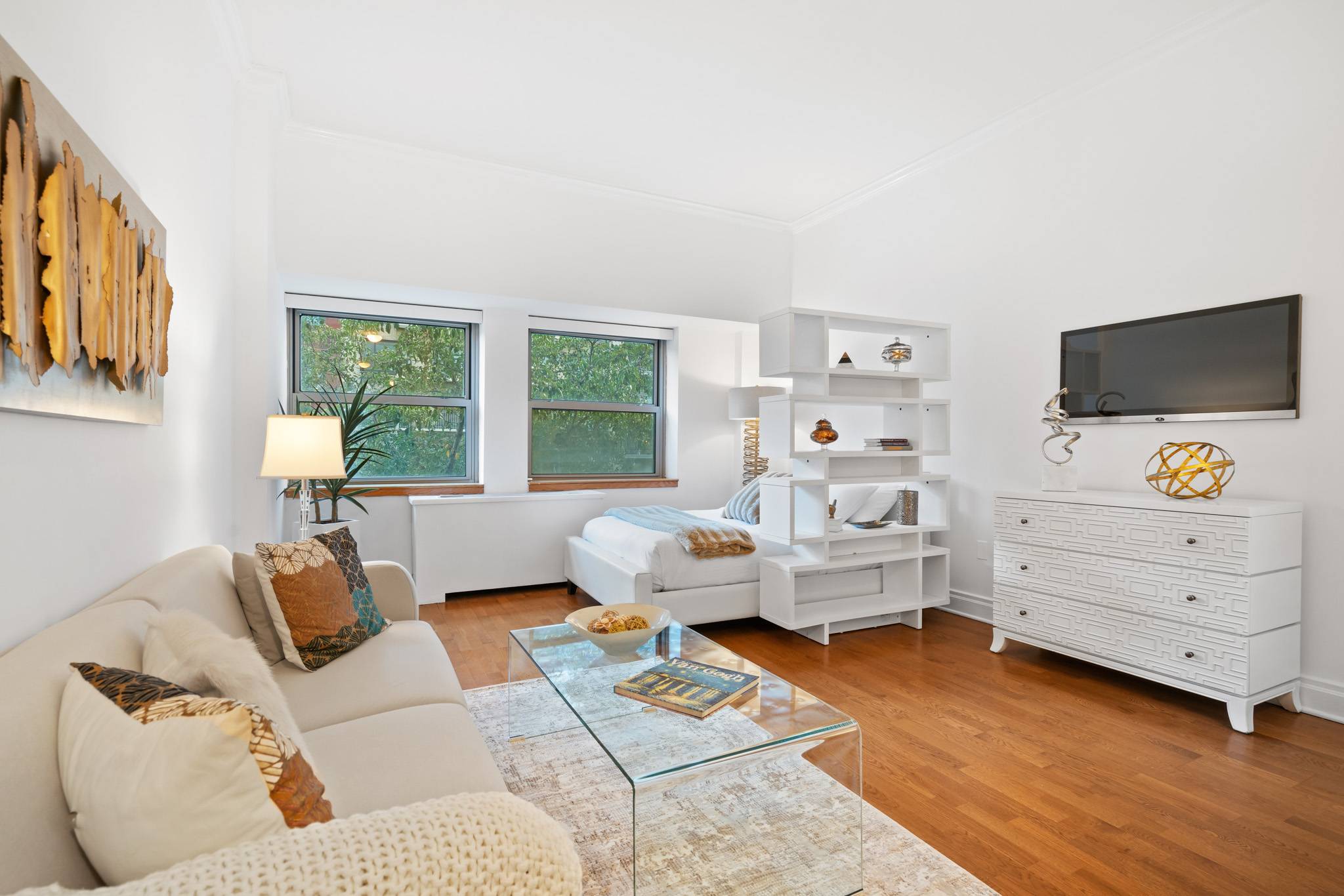 Loft-like, spacious condo studio with 10 ft ceilings and tree tops views available  in the Wellington tower.
