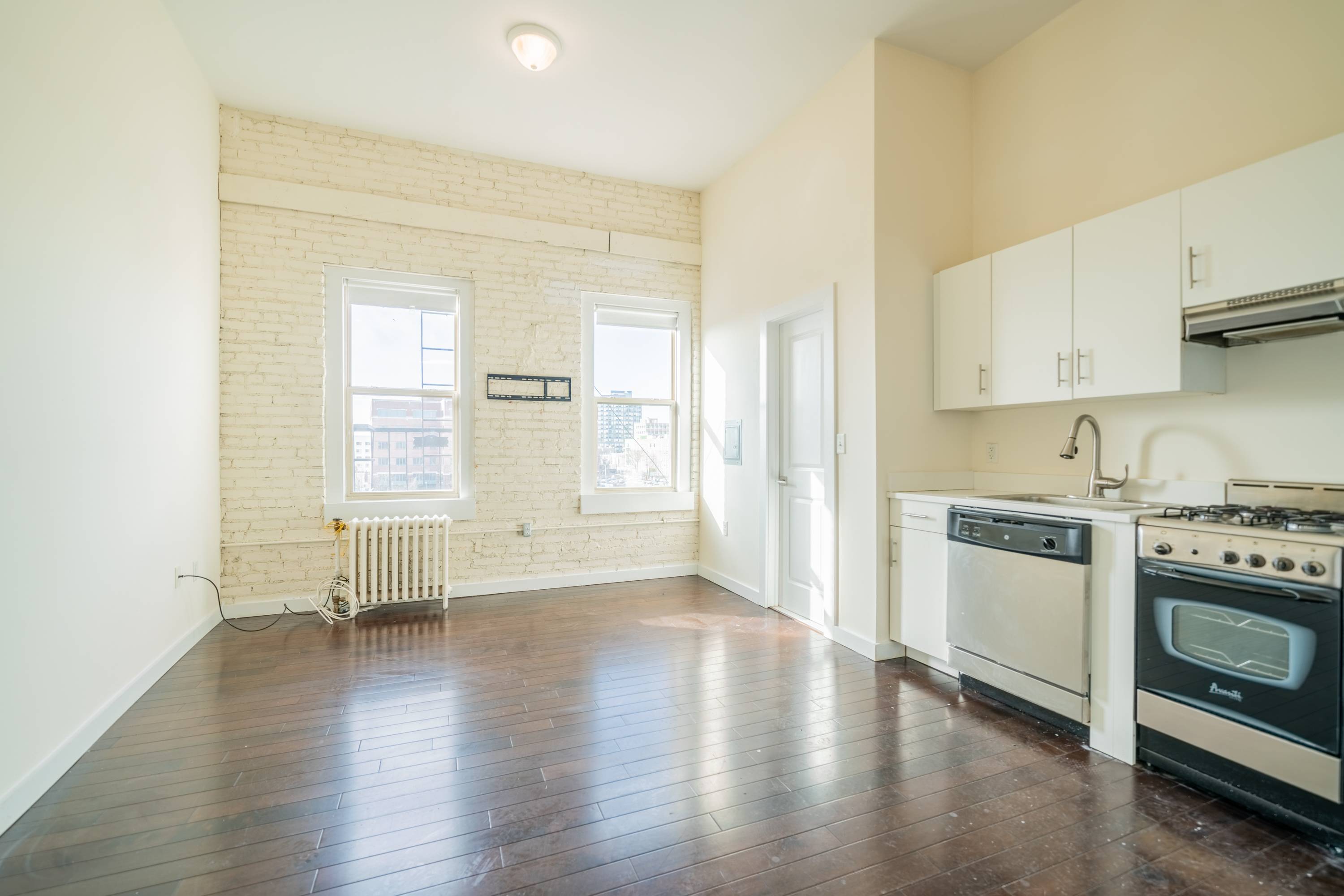 Beautiful Open Studio located across from the Journal Square Path Station.  No Fee and 1 Month Free. Laundry/Elevator Building