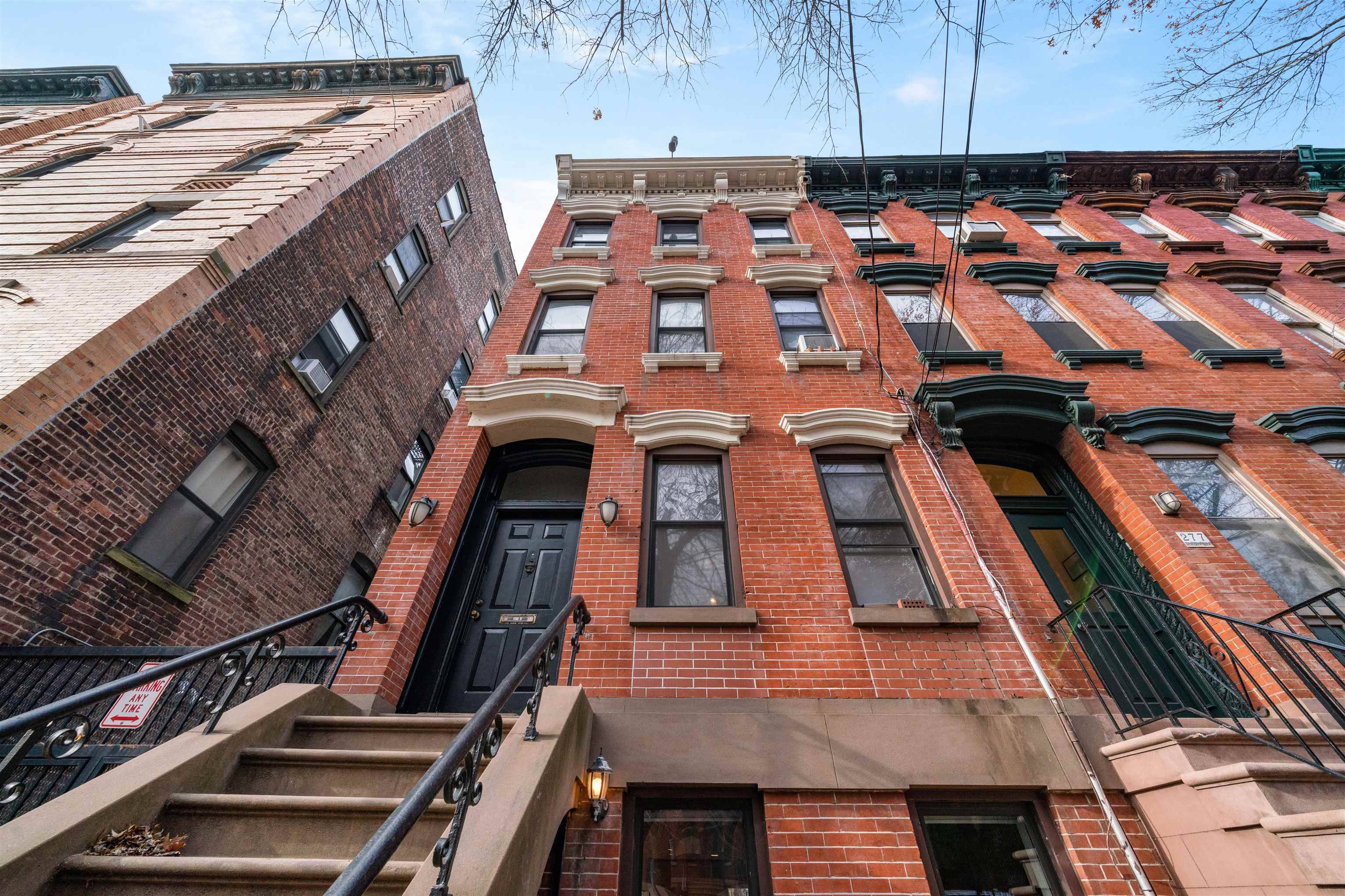 Historic Two Family Brownstone with Exposed Brick and Cathedral-like High Ceilings in Downtown Jersey City