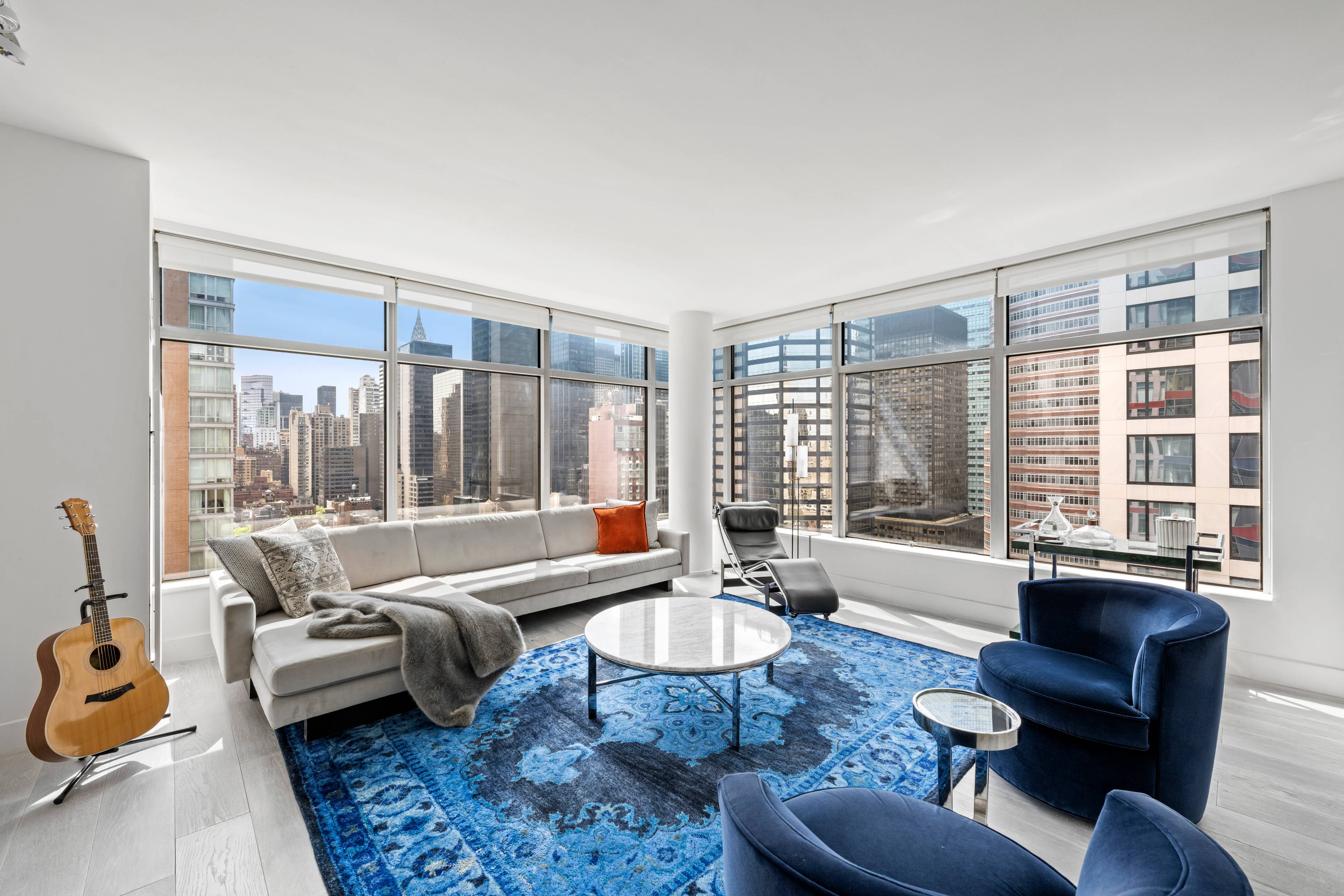 SUN-DRENCHED CORNER UNIT WITH PANORAMIC SKYLINE VIEWS IN HEART OF MIDTOWN