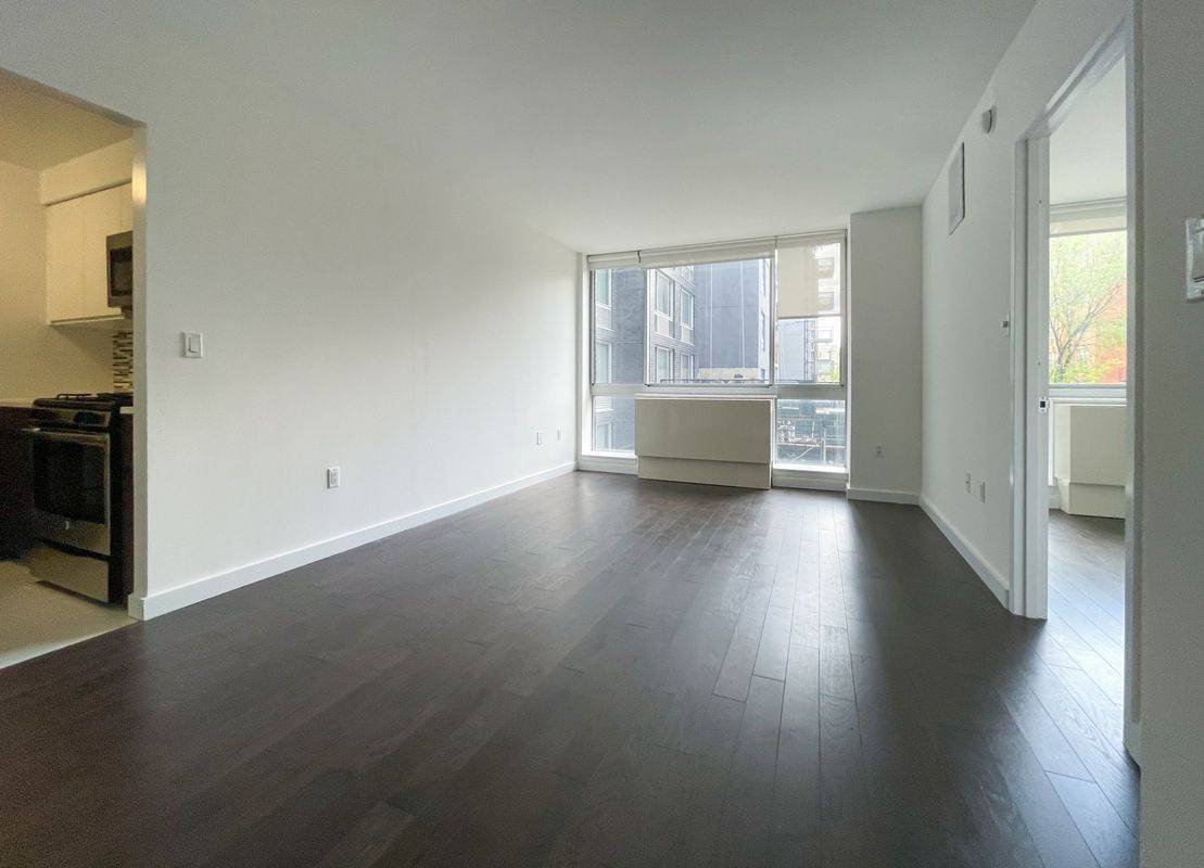 No Fee, Bright & Spacious 1 Bed/1 Bath in East Village, Brand New Hardwood Floors, W/D in Unit, Garage Parking, Furnished & Landscaped Roof Terrace & 2nd Floor Patio W/ BBQ