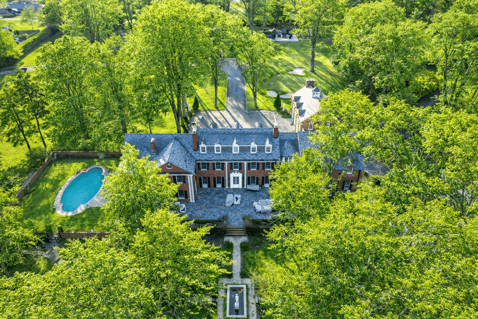 A Rare Architectural Icon | Fully Modernized 1916 Manor Set Behind Private Gates on Eight Park-Like Acres