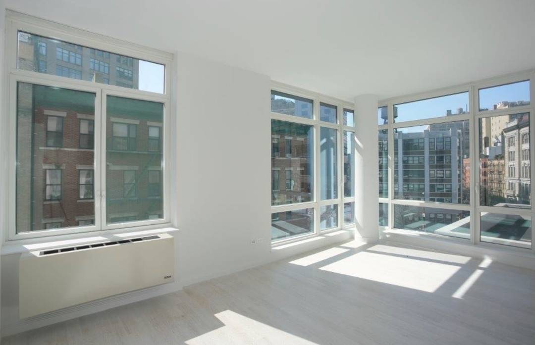NO FEE. Stunning 2 bed/2 bath with large balcony in this chic luxury building in the heart of Soho.