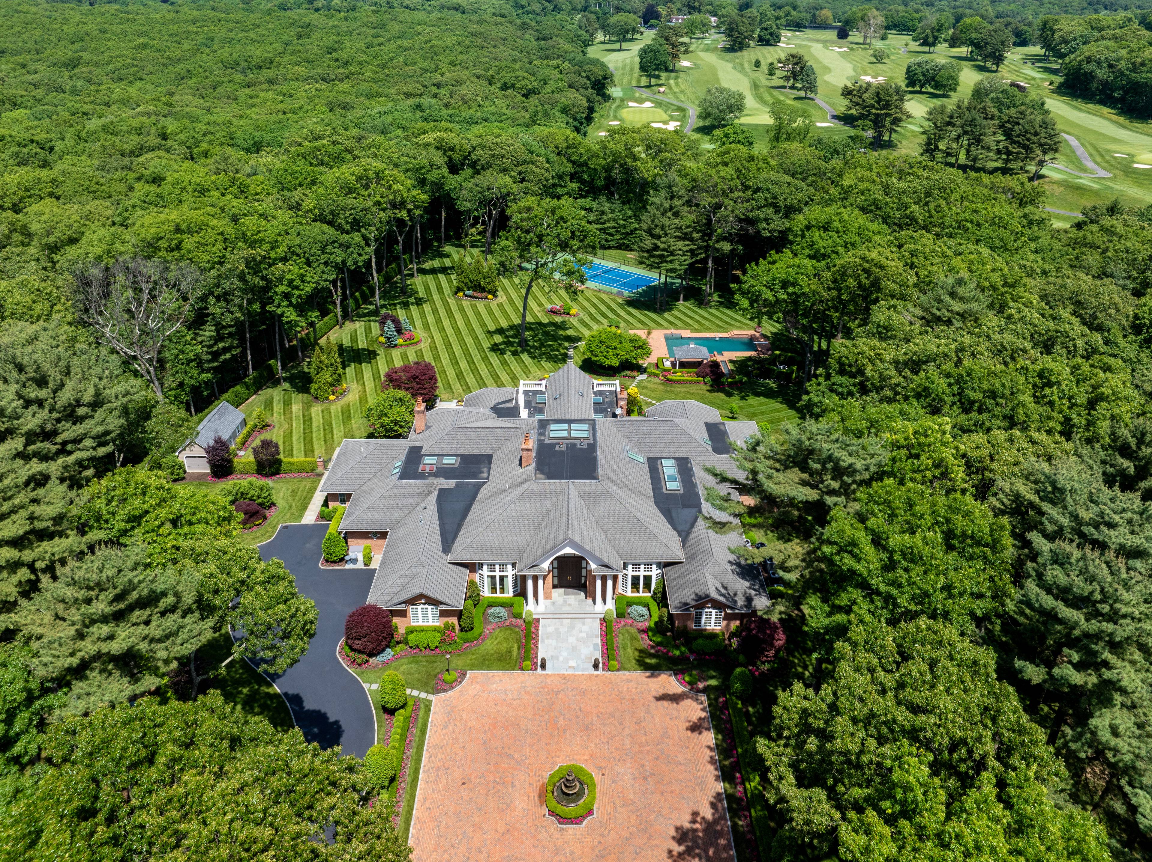 Nestled in the prestigious Chestnut Hill Estate Section of Upper Brookville on 5+ acres