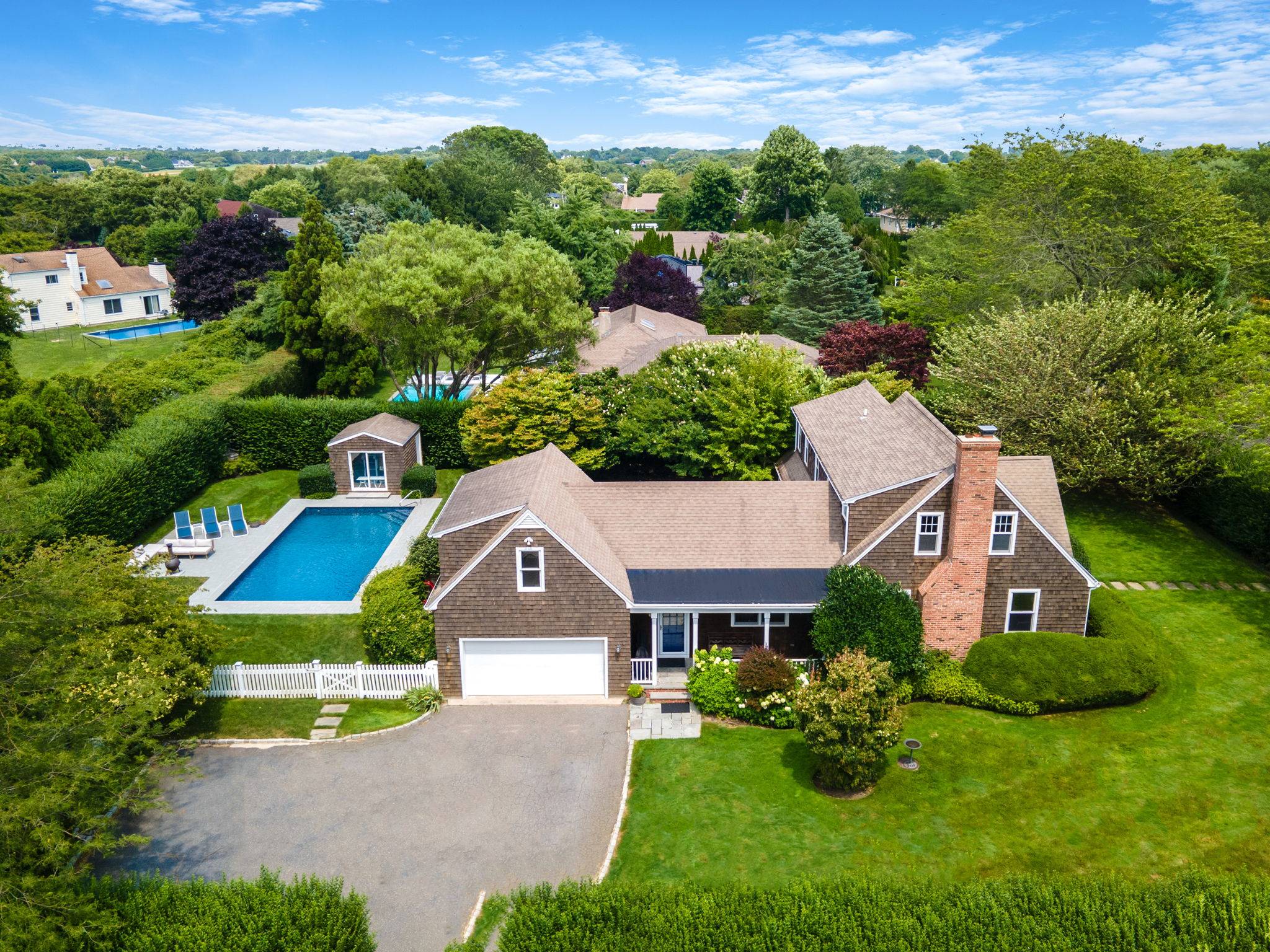 Stunning Hamptons Home with Private Pool and Lush Landscapes