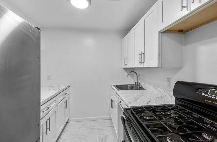 Exquisite triplex offers an abundance of space and sophistication, featuring three spacious bedrooms and 12 thoughtfully sized closets