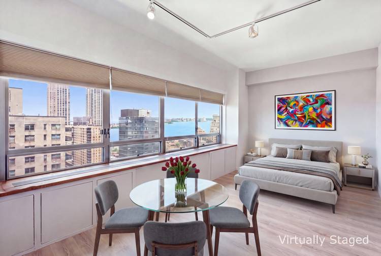 Sun filled Penthouse Alcove studio/convertible one bedroom with extra high ceiling and sparkling River and city views