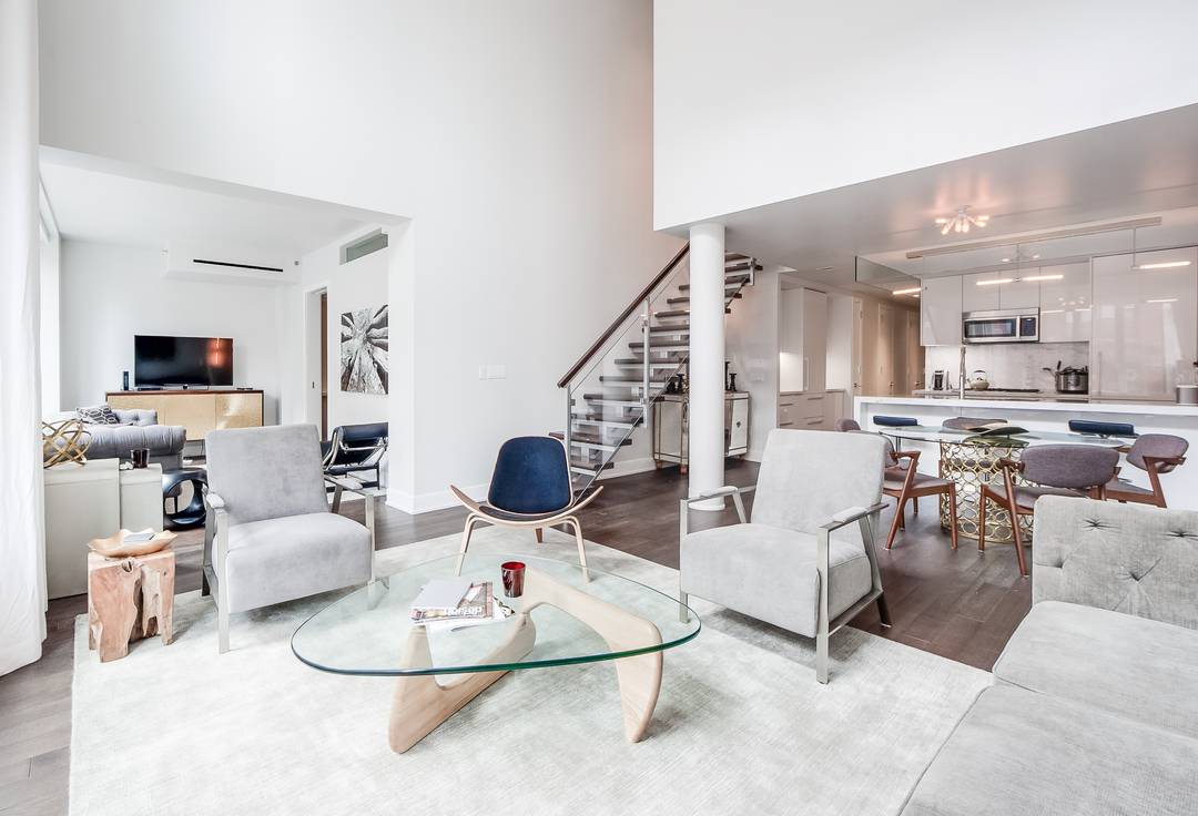 A 2,456-square-foot duplex loft located in one of Tribeca’s newer full-service buildings