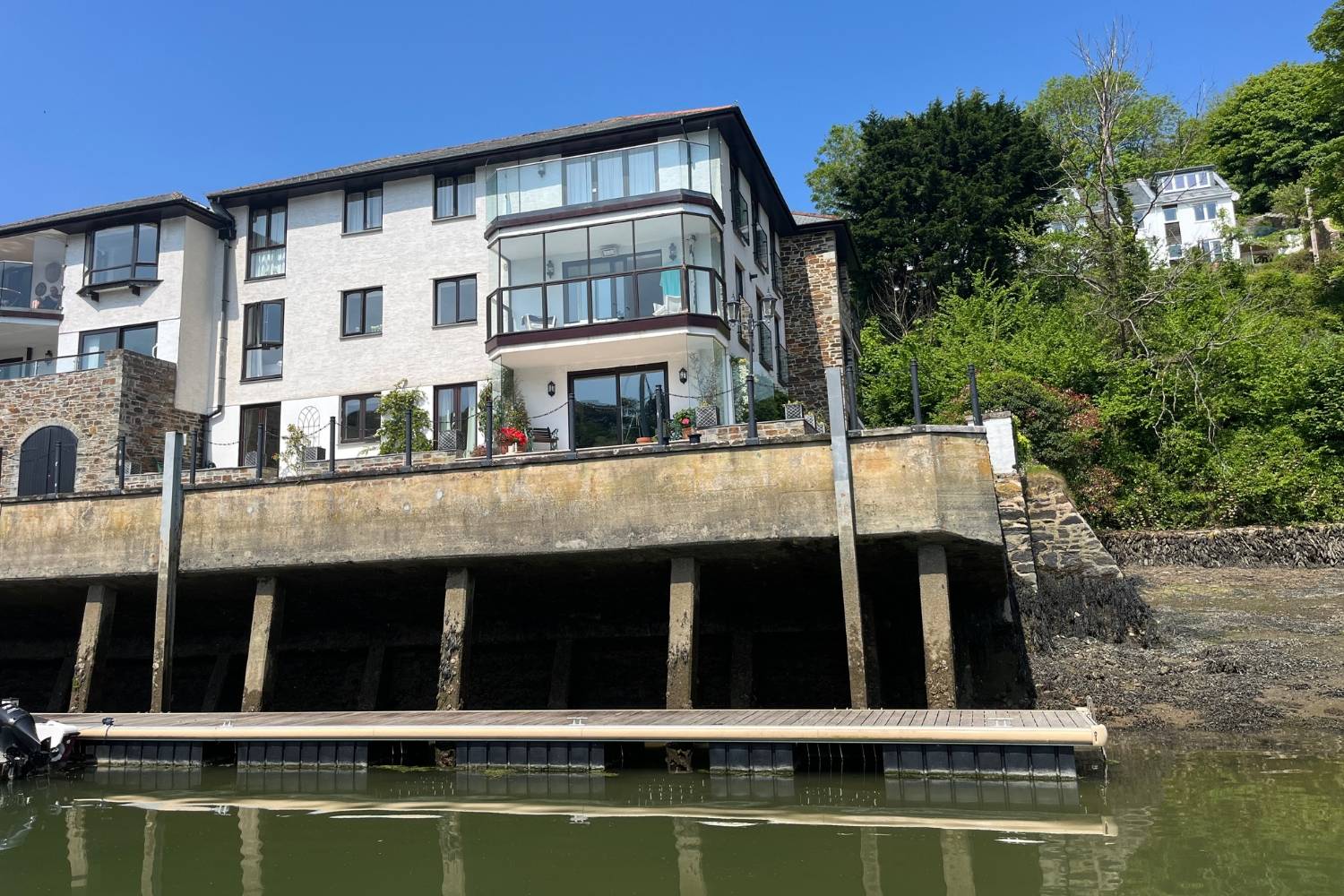 A refined waterside residence with private mooring, panoramic estuary views and elegant lifestyle upgrades throughout.