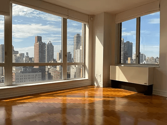 Corner 1BR/1.5BA in Pristine UES FUll Service Building!