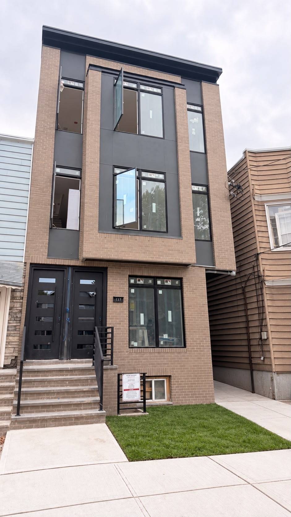 Newly rebuilt multifamily building nearing completion.